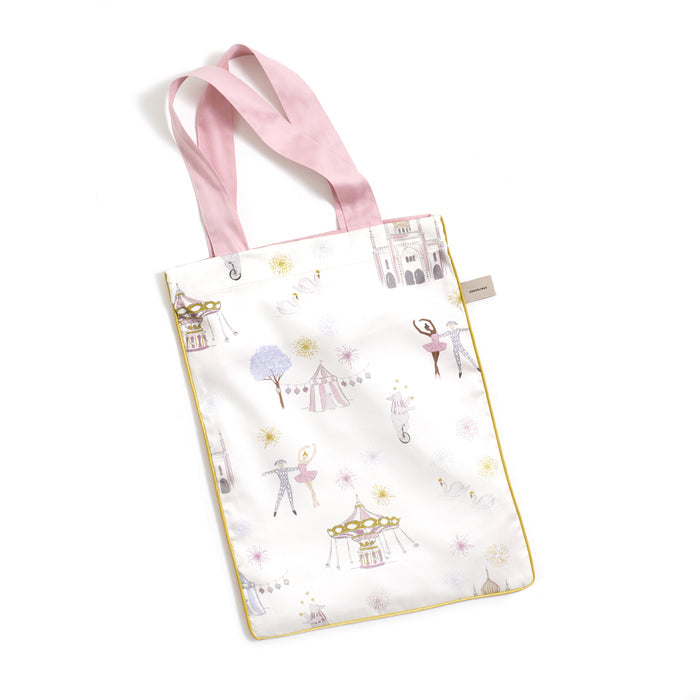 Printed tote bag is included with crib sheet in "Adventures in Wonderland" print in the color rose