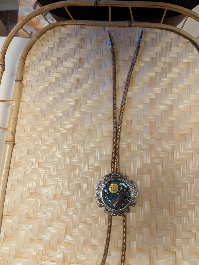 Badass Bolo Tie by BadAssBabe featuring a silver-tone slide and cord, stylish western accessory for men and women.