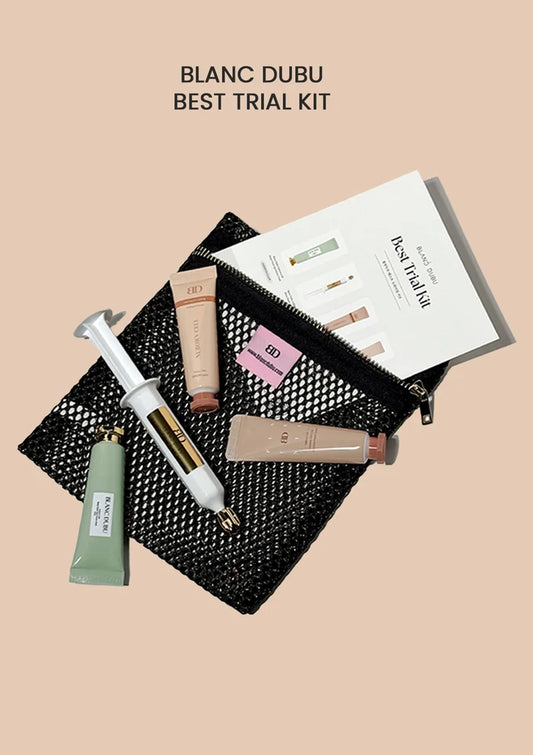 Blanc Dubu best trial kit with various skincare products on a beige background