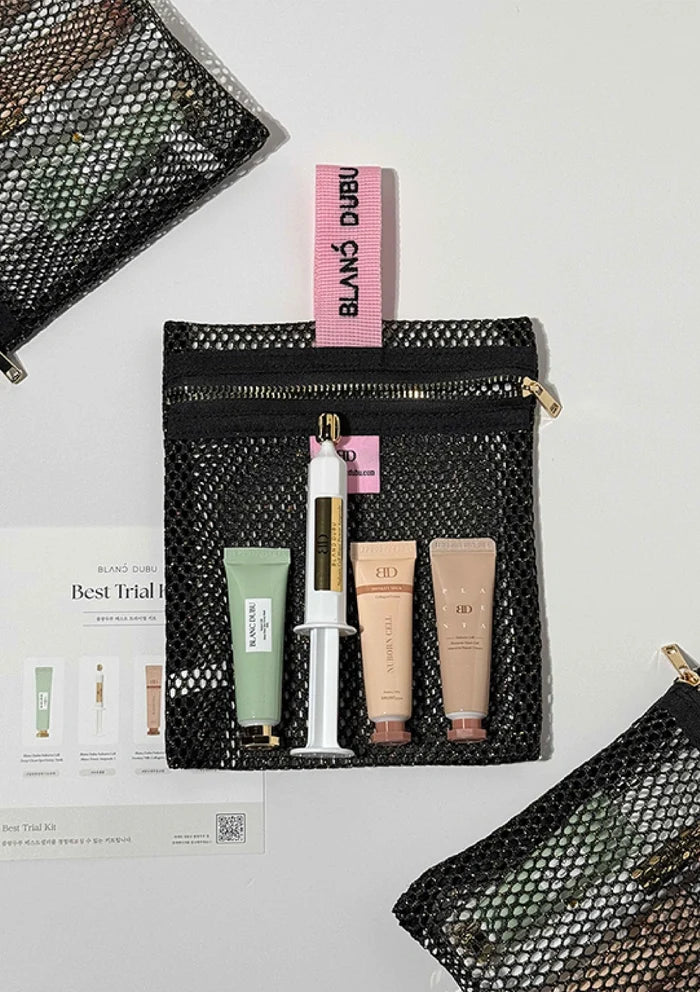 Black mesh pouch with skincare products and a pink box labeled 'DUBO' on a light gray background.