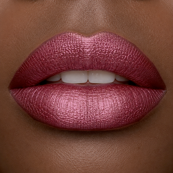 Lip close-up of Runway 
Rogue long wear liquid lipstick in the shade 'Callback' on ethnic skin