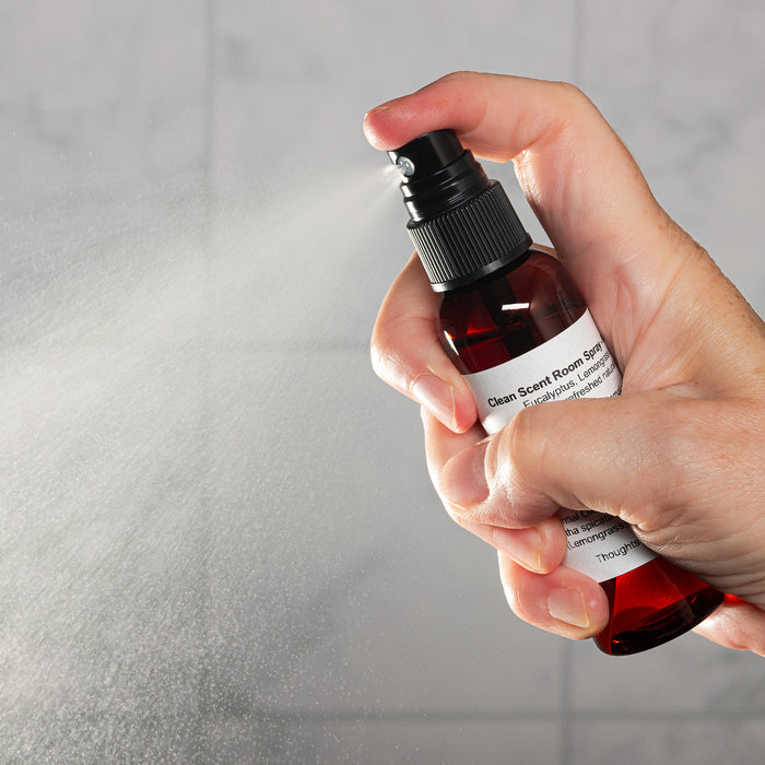 Clean Scent Room Spray 2oz Lifestyle with Human Hand Spraying Square Microbatch Label