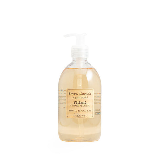 Liquid soap bottle with a label on a white background