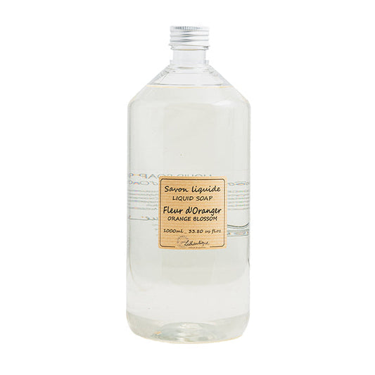 A clear plastic bottle of liquid soap refill labeled 'Authentique Orange Blossom'.