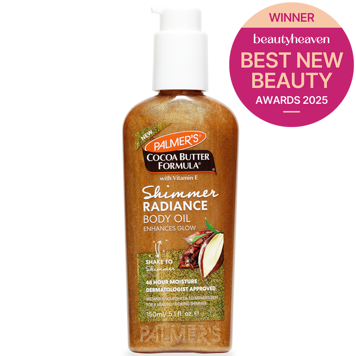 A bottle of Palmer's Cocoa Butter Formula Shimmer Radiance Body Oil with a white pump dispenser, shown on a white background with a pink Beauty Heaven Best New Beauty Awards 2025 badge in the top right corner.