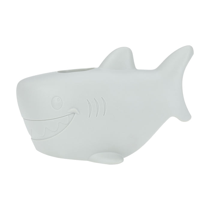 The Nuby Safety Spout Guard is a white, cartoon-style shark figurine with a smiling mouth and top opening—ideal as a playful bathtub faucet protector to help keep children safe at bath time.