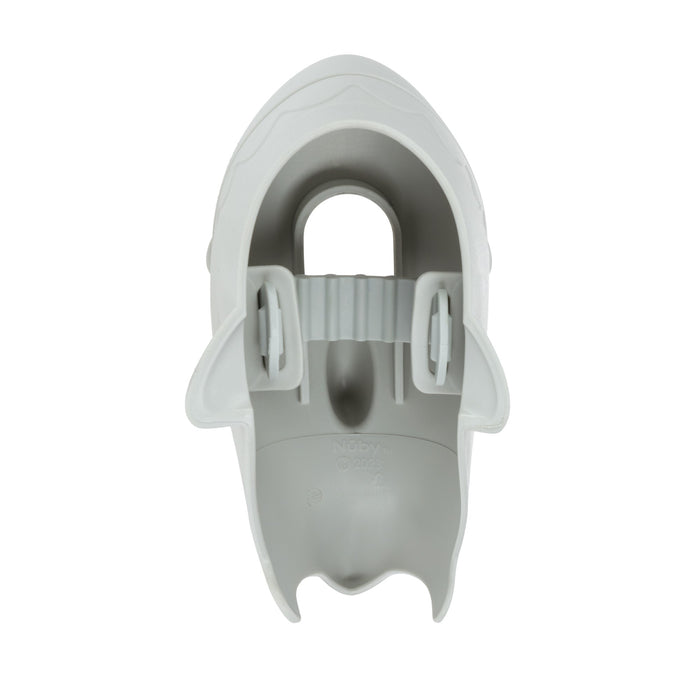 Top view of the Nuby Safety Spout Guard—a gray plastic, shark-shaped faucet cover with an open mouth, dorsal fin, side fins, and central handle. Its hollow design fits most faucets to help keep children safe during bath time.