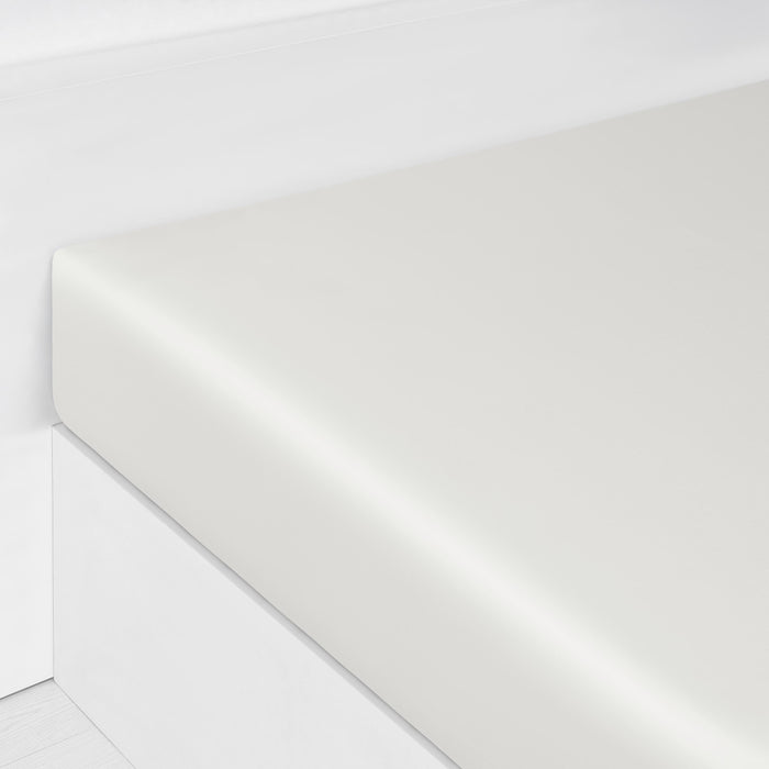 Solid Fitted Sheet in Ivory corner shot of bed