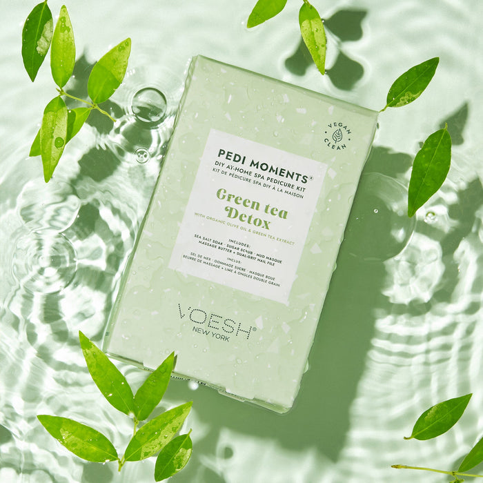 VOESH Green Tea Detox pedicure kit on a light green background with leaves