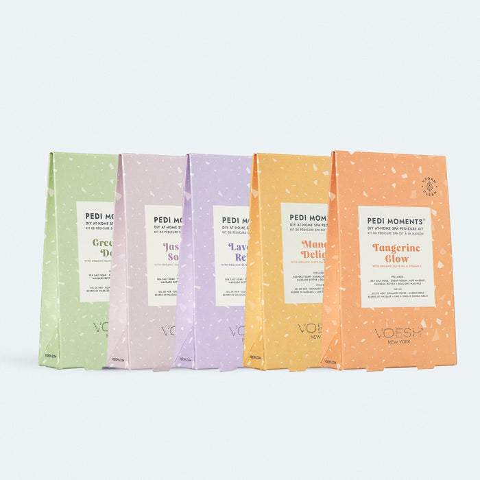 Five Voesh pedicure kit packages in various colors on a white background
